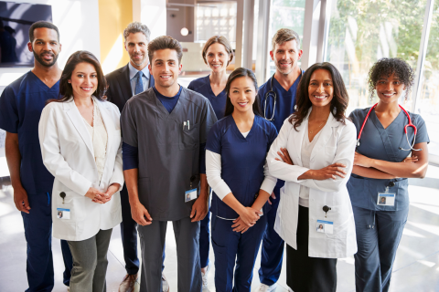 Photo of a group of healthcare workers smiling at the camera