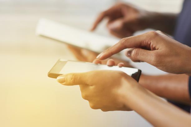 hands with smartphones