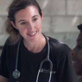 Nurse smiling with patient
