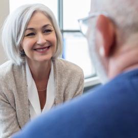 Therapist smiling at patient.