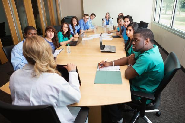 Group of health care works around a table