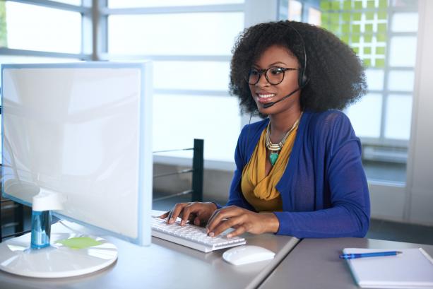 Woman typing at a computer