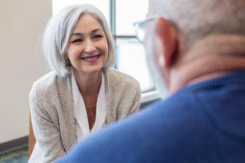Therapist smiling at patient.